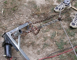 Winch anchored at a point on very long cable